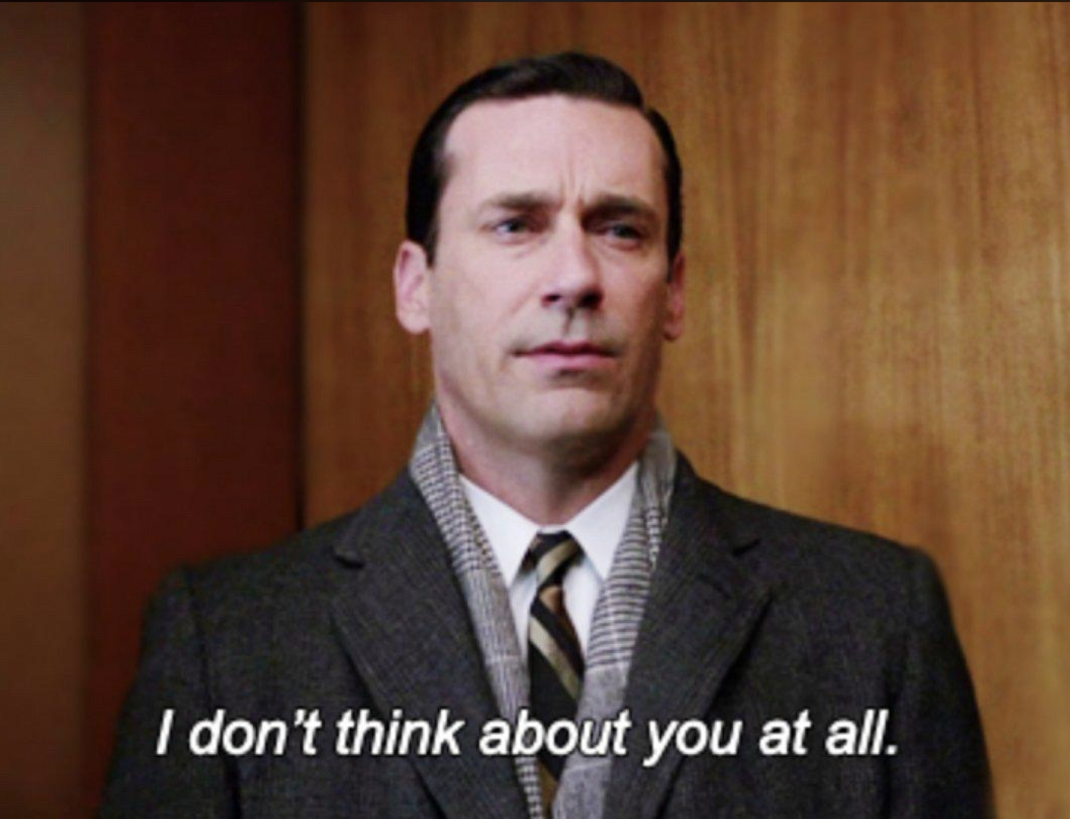 Don Draper stands in an elevator speaking to Ginsberg, saying "I don't think about you at all."